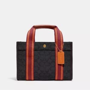 Coach like new spin signature tote 27 see all photos no tag